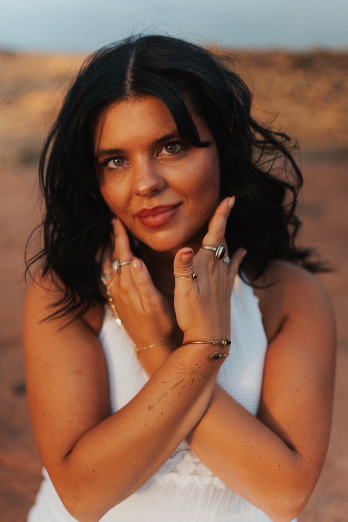 Kelsey, founder and tarot reader, in warm desert light